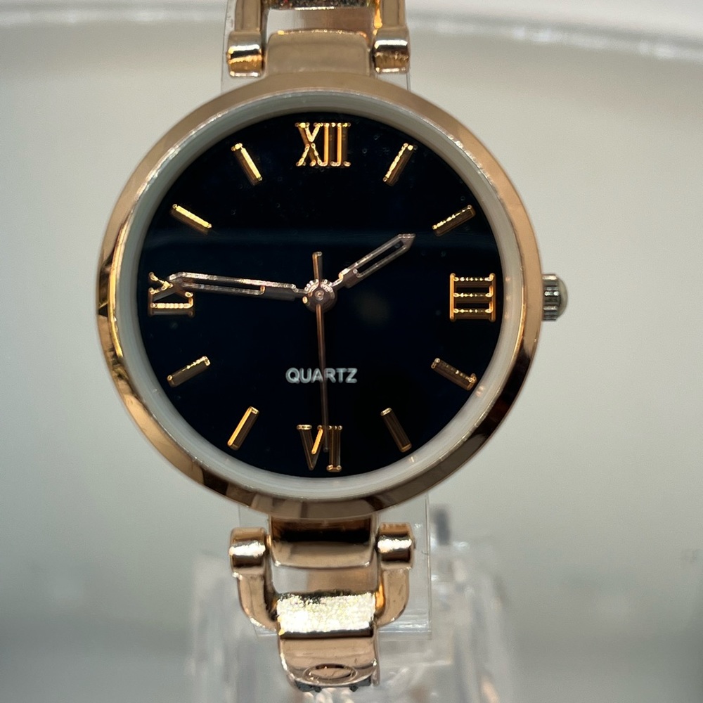 A beautiful rose gold and black watch! Nice touch with the leather on band!